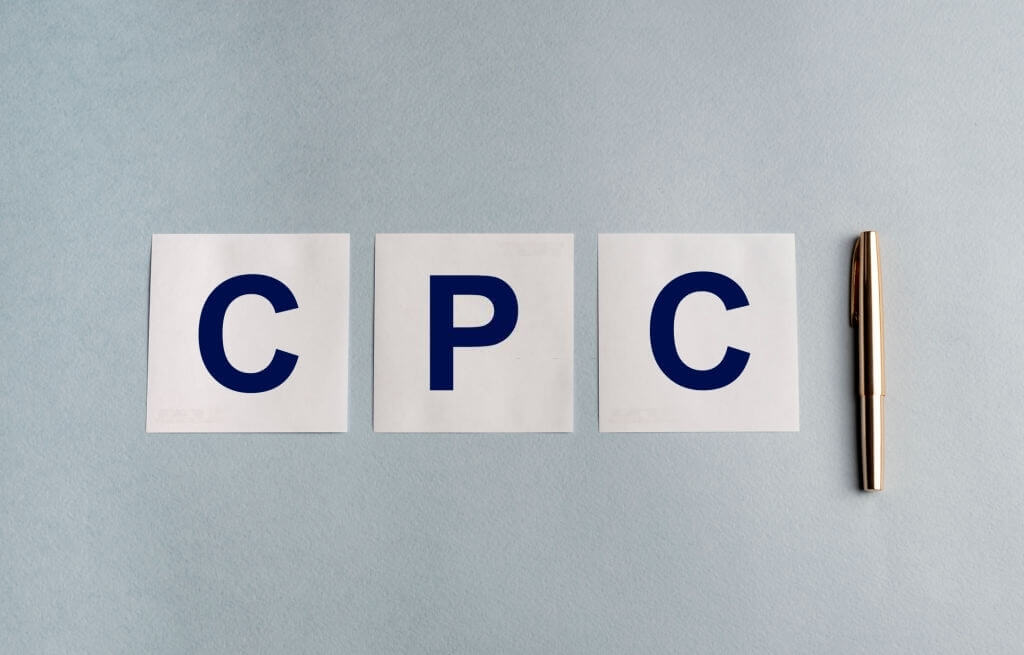 CPC letters on white paper and next to a pencil
